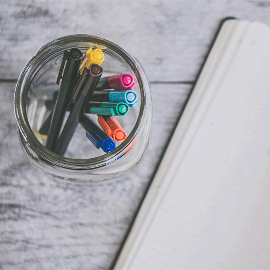 Brushes, pencils, and pens on a white background to illustrate how to remove stains from ink, glue, paint stains, etc.